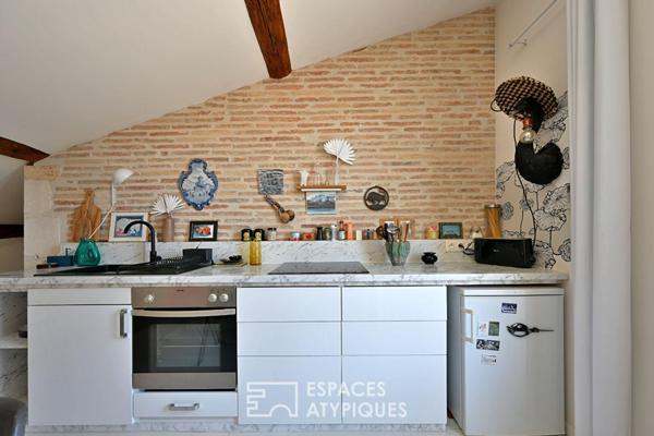 Appartement de type loft avec terrasse sur les toits