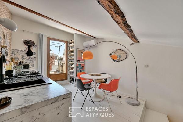 Appartement de type loft avec terrasse sur les toits