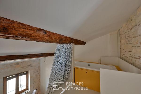 Appartement de type loft avec terrasse sur les toits