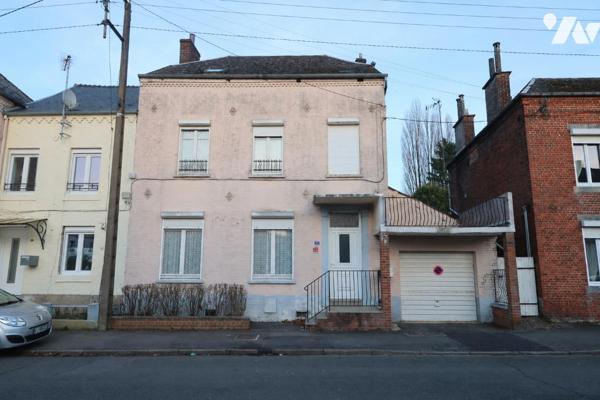 Spacieuse maison proche du centre-ville, 3 chambres, garage - vendue avec le locataire en place.