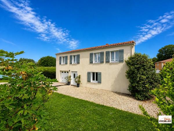 Maison T5 avec grand garage et jardin