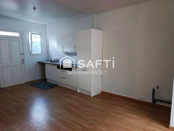 Maison de ville en cœur de ville avec jardin proche des commodités