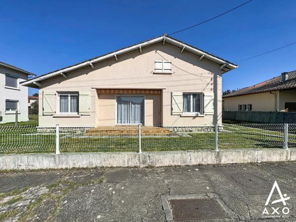 Maison de plain pied avec véranda et garages