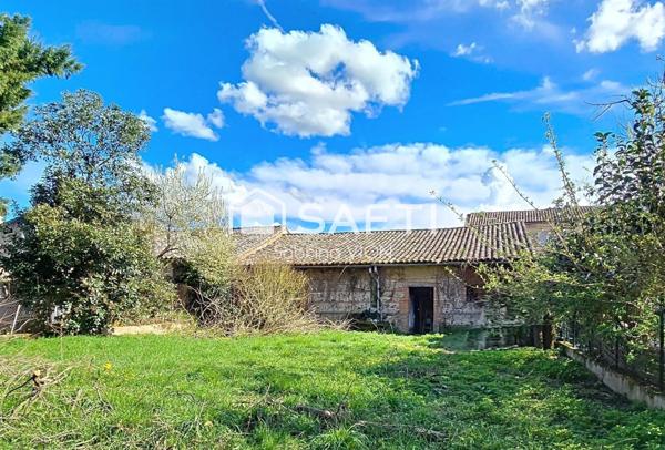 MAISON DE VILLE AVEC GRAND GARAGE ATTENANT ET JARDIN