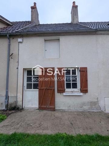 Maison à rénover avec garage, cave et dépendance