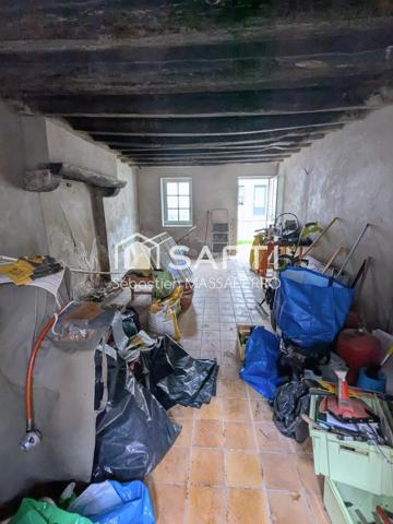 Maison à rénover avec garage, cave et dépendance