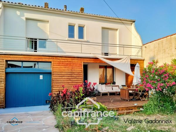 Maison individuelle avec jardin et garage proche centre-ville