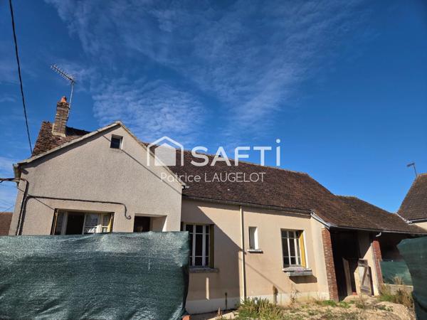 Maison 2 chambres avec garage et beau potentiel
