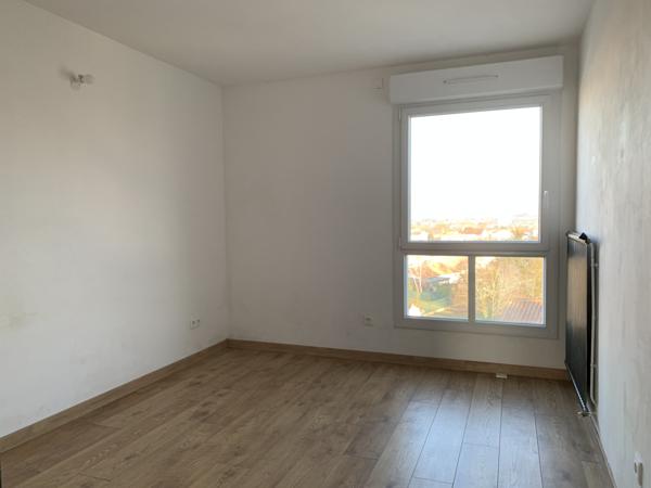 Appartement T3 avec balcon, cave et garage