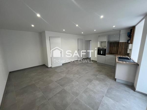 T2 au rez de chaussée dans un immeuble en pierres entièrement rénové 38460