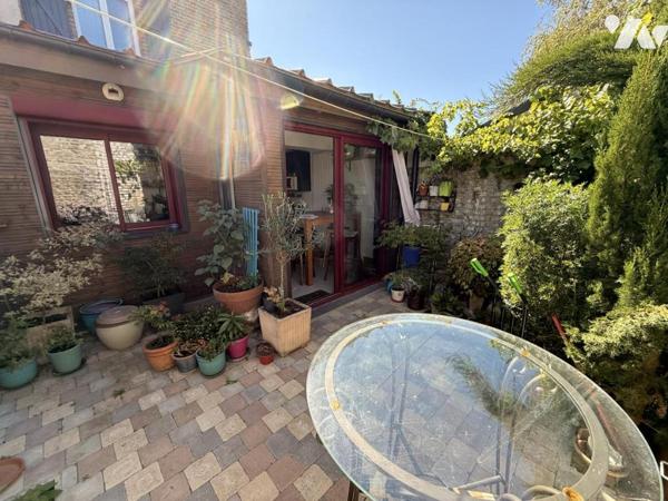 Maison semi mitoyenne avec cour