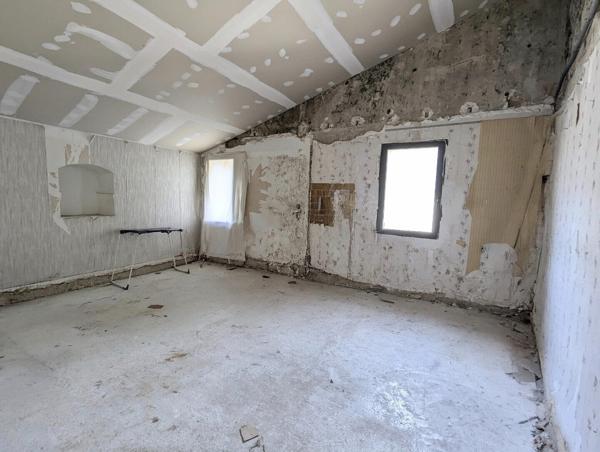 Immeuble 1 commerce + 4 appartements