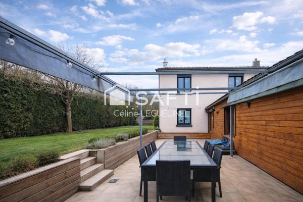 À Ouerre, maison familiale lumineuse avec vie de plain-pied, jardin, terrasse et atelier, au calme et proche Dreux/RN12 avec école sur place.