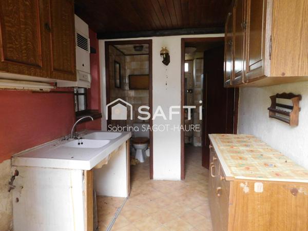 Longère sur parc de 2460m2 avec grange et garage