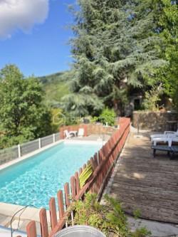 EXCLUISIVITE 
Vous souhaitez vivre dans un havre de paix, en plein cœur de la nature, avec une vue imprenable, plein sud, sur les Cévennes, à 10 minutes de toutes commodités, Le Vigan mais aussi à environ 1 h de Montpellier, je vous propose cette maison Située à Arphy dans le département du Gard,  cette maison des années 80, tout à fait originale et conviviale, de 130 m2 et ses 4 chambres, saura vous séduire et vous apportez le confort et l'originalité d'habiter un lieu hors du commun, habitable immédiatement, écoles, collège et Lycée, cinéma, hôpital à proximité.
Suivant les plans d'un architecte reconnu dans la région elle se compose :
D'une belle cuisine de qualité équipée ouverte sur le séjour, coin salon avec cheminée, pièce mansardée, 4 chambres, grande salle de bain, wc, cellier.
Grande terrasse couverte vue dégagée, sous-sol, 2 garages (16 et 25 m2).
Terrain en traversiers entièrement aménagé en jardins, superbes murs en pierre, avec accès à la piscine au milieu des arbres, chênes et autres.
Assainissement individuel. 
Chauffage bois (poêle Godin) et chaudière fuel mixte eau chaude et chauffage qui fonctionne très bien. Consommation 1500L/an.
Electricité : 80 euros/mois (Maison équipée double vitrage).
Toiture bon état et très bien isolée avec plancher en châtaignier.
Une maison agréable à vivre où vous poserez vos valises.