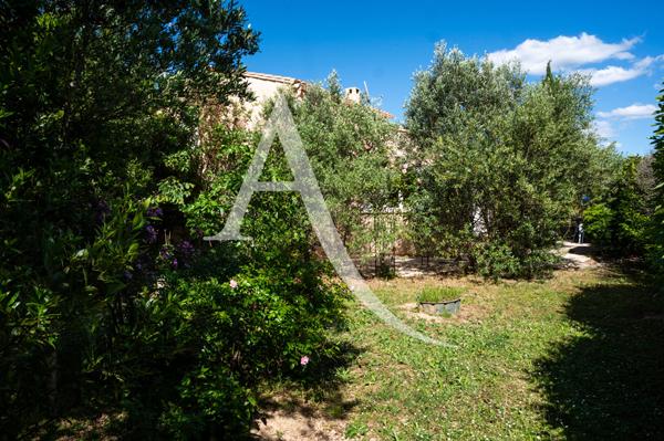 Maison de charme avec jardin, garage et terrasse aménagée proche Carcassonne