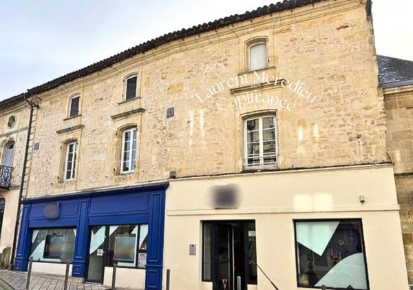 Immeuble de caractère en pierre – Investissement sécurisé avec bail commercial