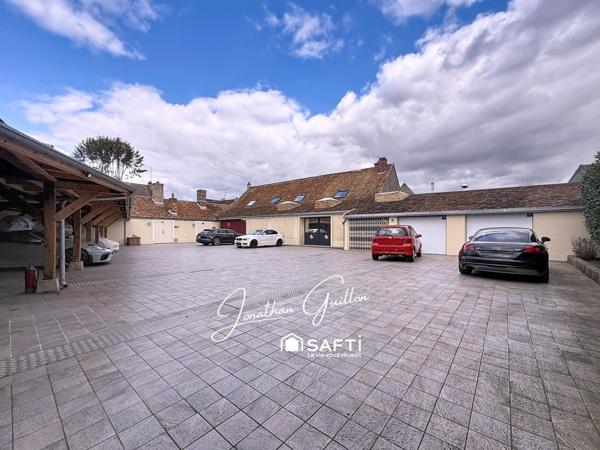 Immeuble composé de locaux commerciaux et d’un appartement – idéal investissement.