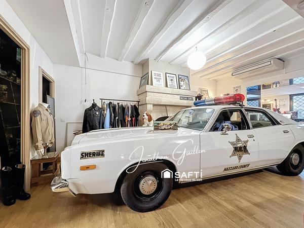 Immeuble composé de locaux commerciaux et d’un appartement – idéal investissement.