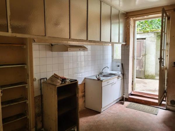 Maison de ville à restaurer au fort potentiel