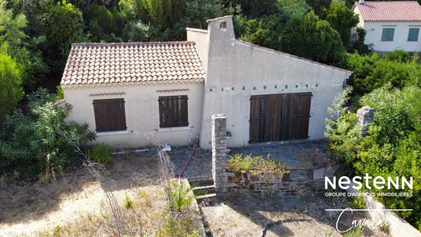 Terrain à fort potentiel avec maison des années 60 à rénover