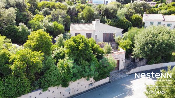 Terrain à fort potentiel avec maison des années 60 à rénover