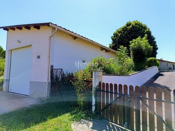 Terrain d'agrément + garage à camping-car