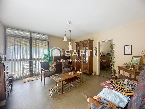 Appartement 3 pièces de 58 m² à rénover avec balcon, cave et stationnement