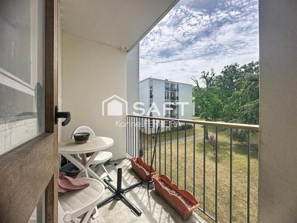 Appartement 3 pièces de 58 m² à rénover avec balcon, cave et stationnement