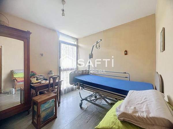 Appartement 3 pièces de 58 m² à rénover avec balcon, cave et stationnement