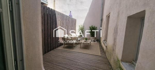 Appartement haussmannien rénové avec terrasse rare en plein cœur de Béziers.