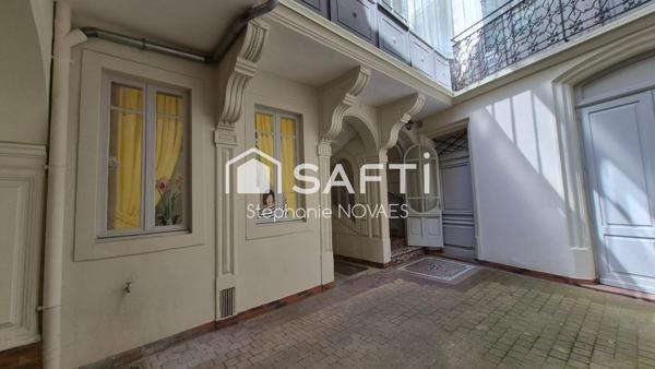 Appartement haussmannien rénové avec terrasse rare en plein cœur de Béziers.