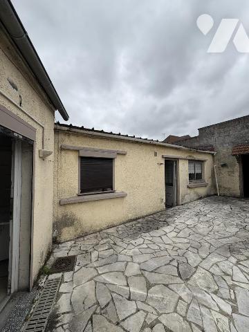A Oignies, Immeuble à usage mixte, avec habitation et local professionnel