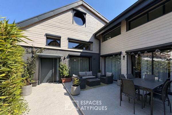 Maison contemporaine avec garage double et place de stationnement
