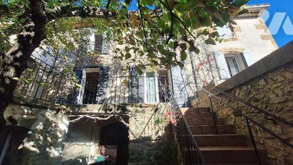 Batisse avec terrain constructible