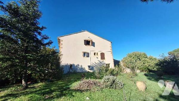 Batisse avec terrain constructible