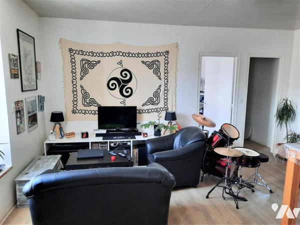 Immeuble commercial + 2 logements