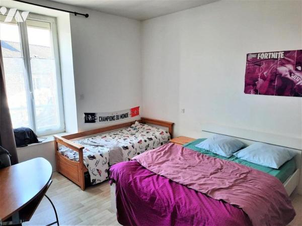Immeuble commercial + 2 logements
