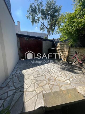 Maison ,jardin ,garage proche commerce,transport