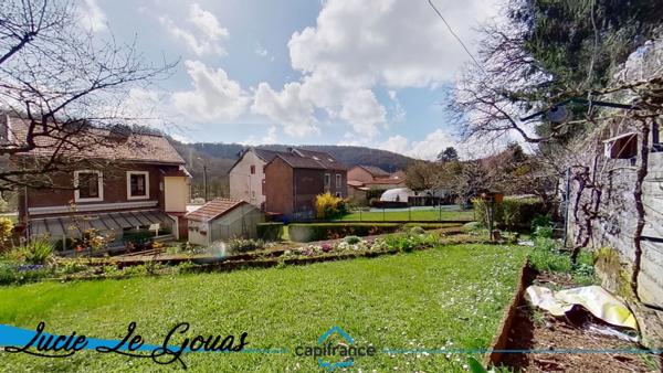 Maison individuelle de 146m², garage de 104m² et jardin