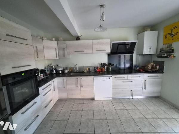 Appartement de 116m2 avec jardin et garage 