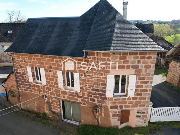 Maison en brasier rénovée avec dépendances et terrain.