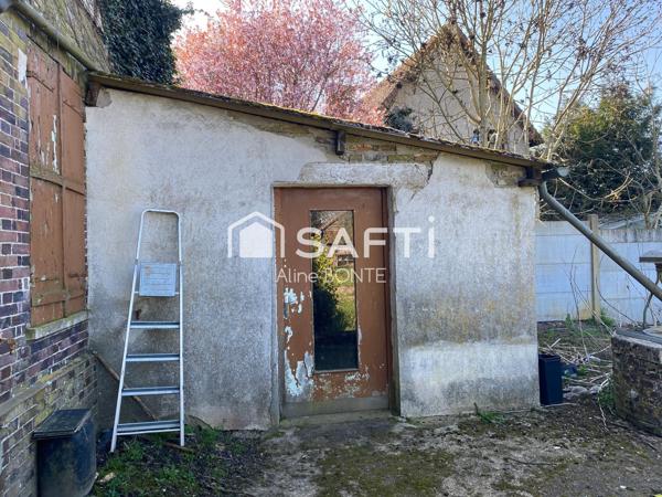 Maison en briques avec une dépendance