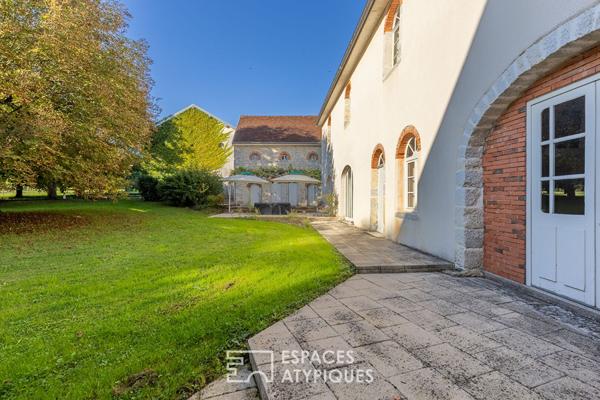 Propriété en pierre dans son parc arboré