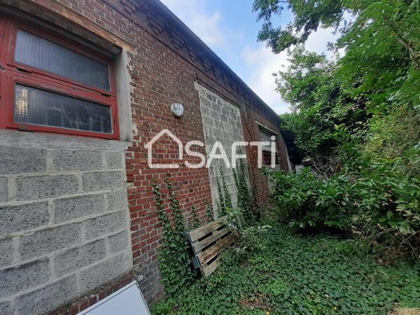 Beaux volumes à aménager en appartements sur un terrain avec parking