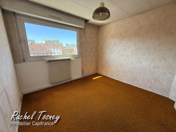Appartement  BELFORT - BEAU POTENTIEL POUR CE T4 TRAVERSANT de 94m² -  BALCON et GARAGE !!
