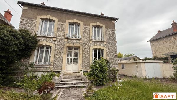 Maison bourgeoise avec jardin au centre ville