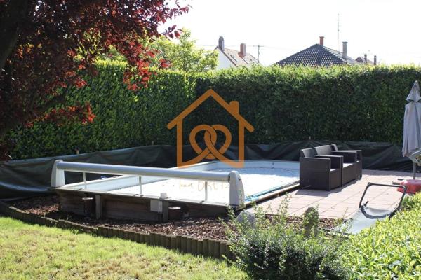 En exclusivité Jolie Maison de 150m² au sol à HOLTZHEIM avec piscine chauffée, climatisation sur 7 ares de terrain