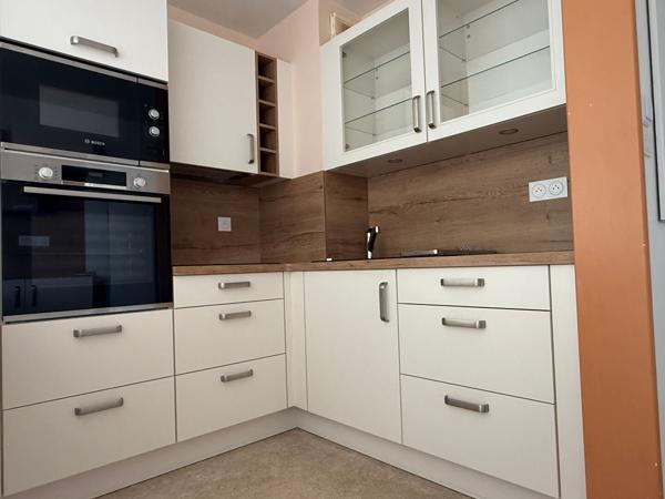 Appartement avec ascenseur, terrasse, garage et vue dégagée sur jardin