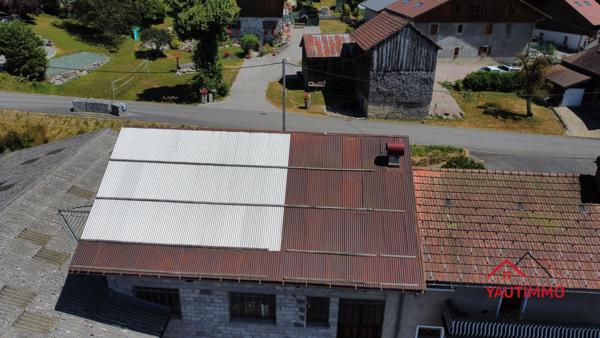 Villard (74420) Ensemble immobilier avec terrain constructible de 2 800 m² en zone UA – Villard, proche Boëge